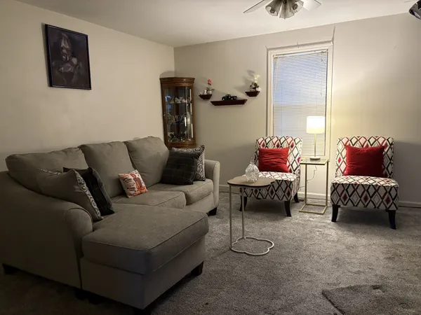 a living room with furniture and a couch