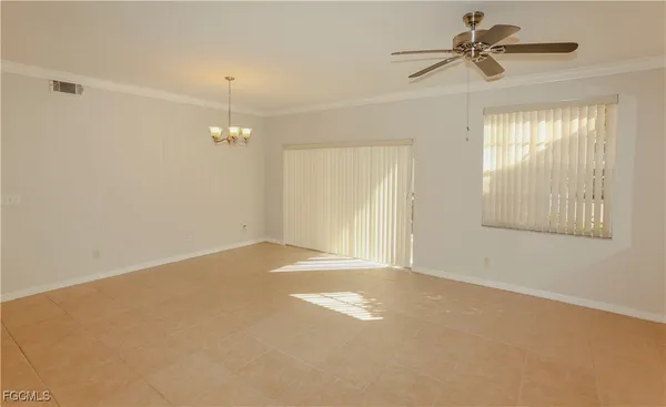 a view of empty room with a ceiling fan