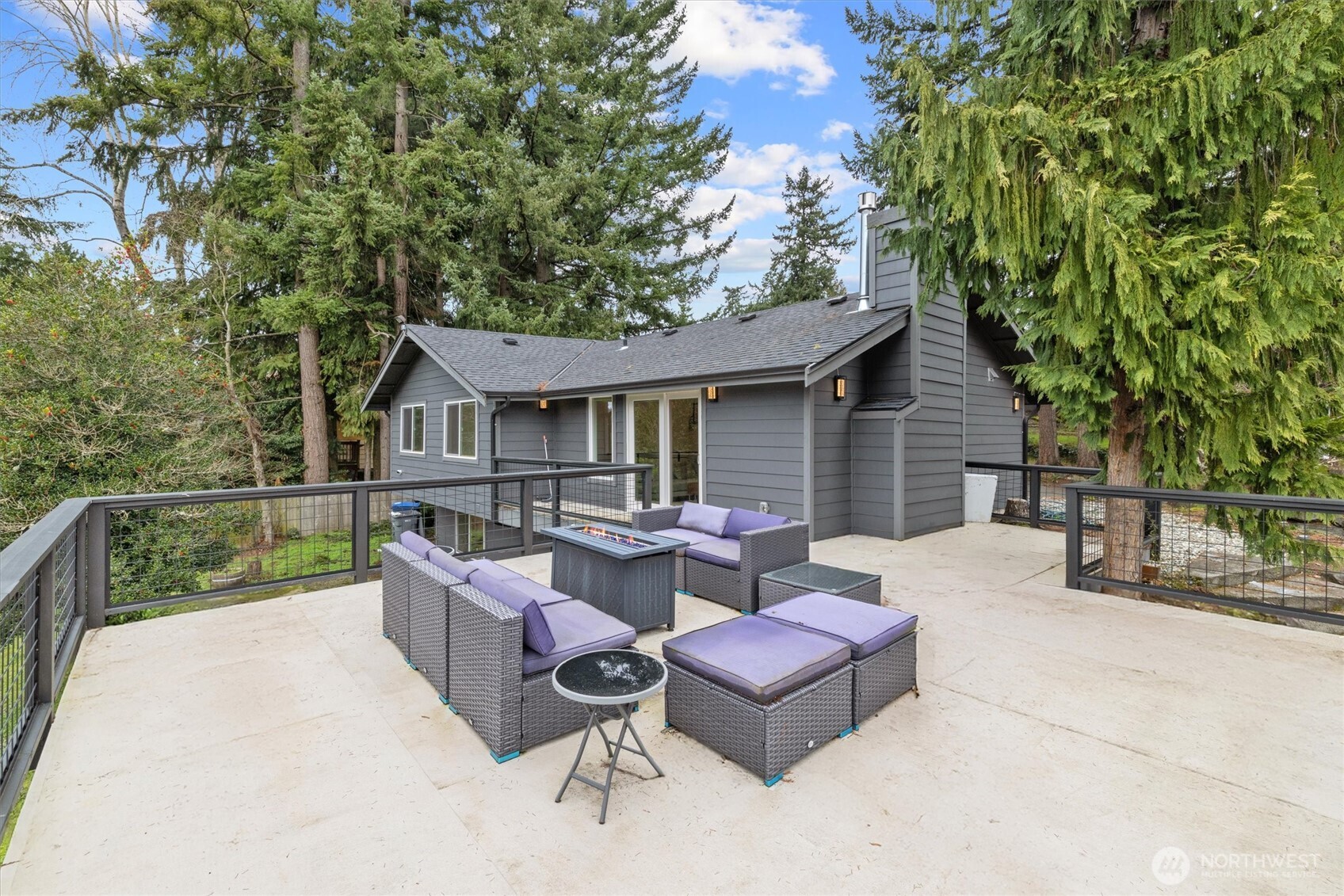 a view of house with backyard and a garden