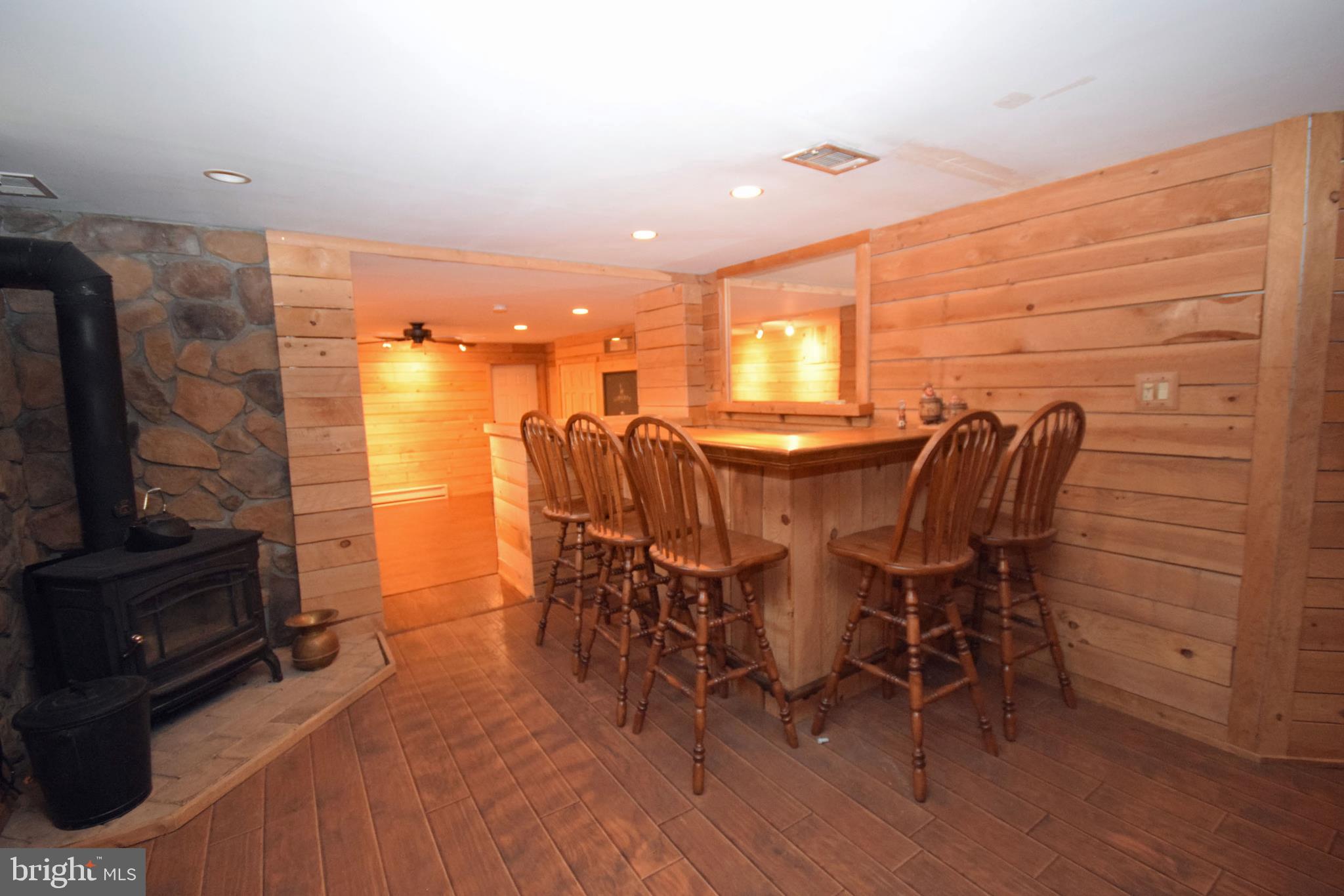 375 Gleaves Road Springfield, PA 19064 - Photo 22 of 38 Wood burning stove adds warmth to the Bar Area