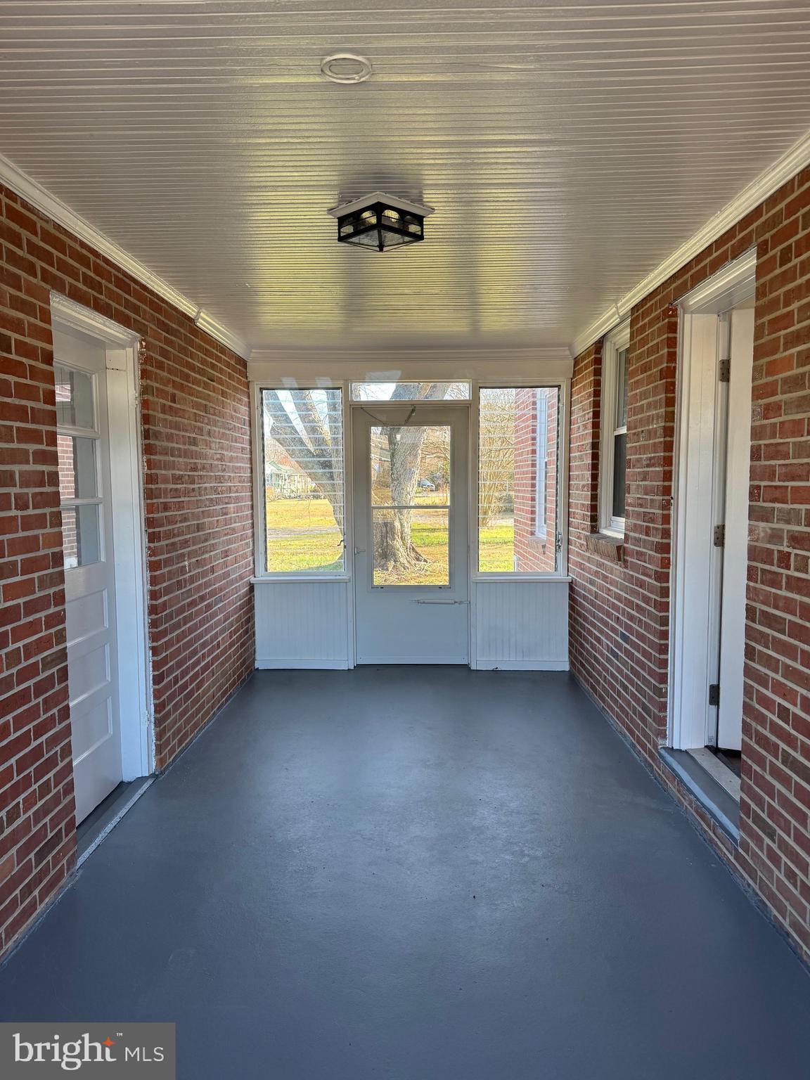 52 Lake Road Lottsburg, VA 22511 - Photo 10 of 42 Breezeway with jalousie windows