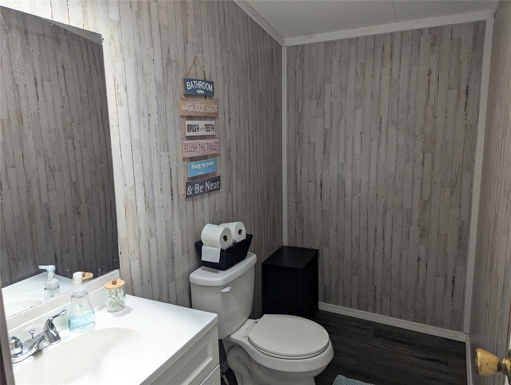 206 Oak Street Blue Ridge, TX 75424 - Photo 9 of 9 Half Bath - there is available plumbing behind the paneling to have a shower installed if buyer chose to do after purchase.