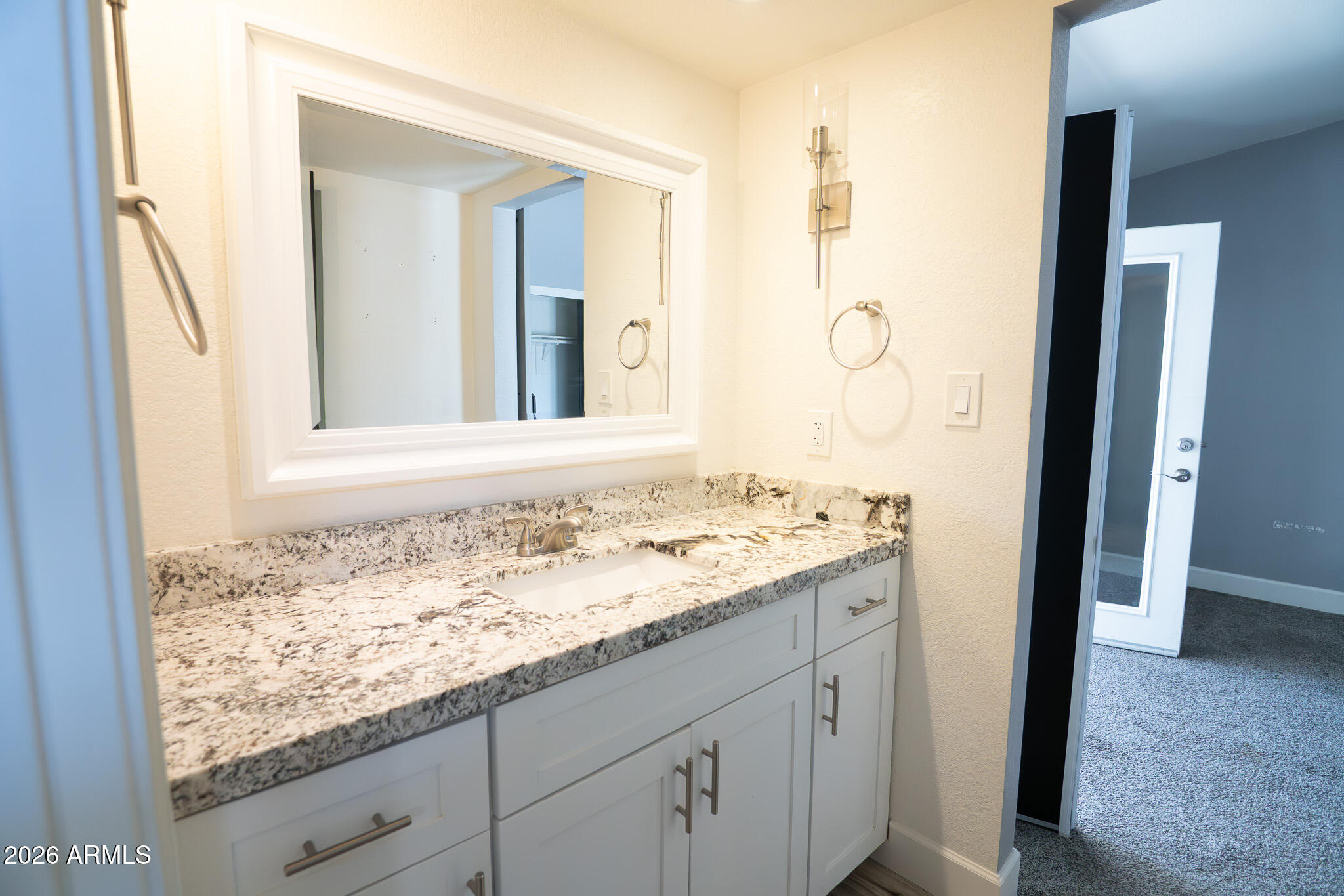 5100 North Miller Road, Unit 3 Scottsdale, AZ 85250 - Photo 19 of 31 a bathroom with a granite countertop sink and a mirror