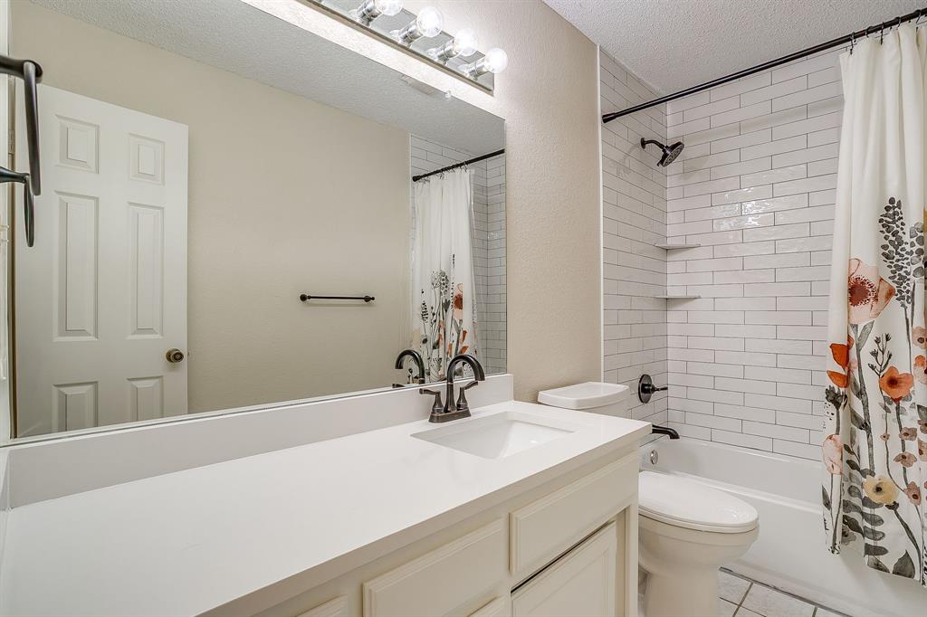 8613 Silver Creek Road White Settlement, TX 76108 - Photo 25 of 40 a bathroom with a sink toilet and shower