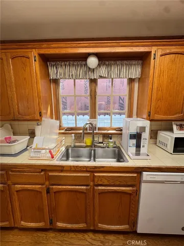 a kitchen with a sink and cabinets