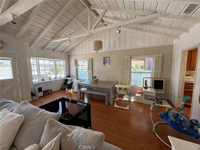 a living room with furniture window and a table