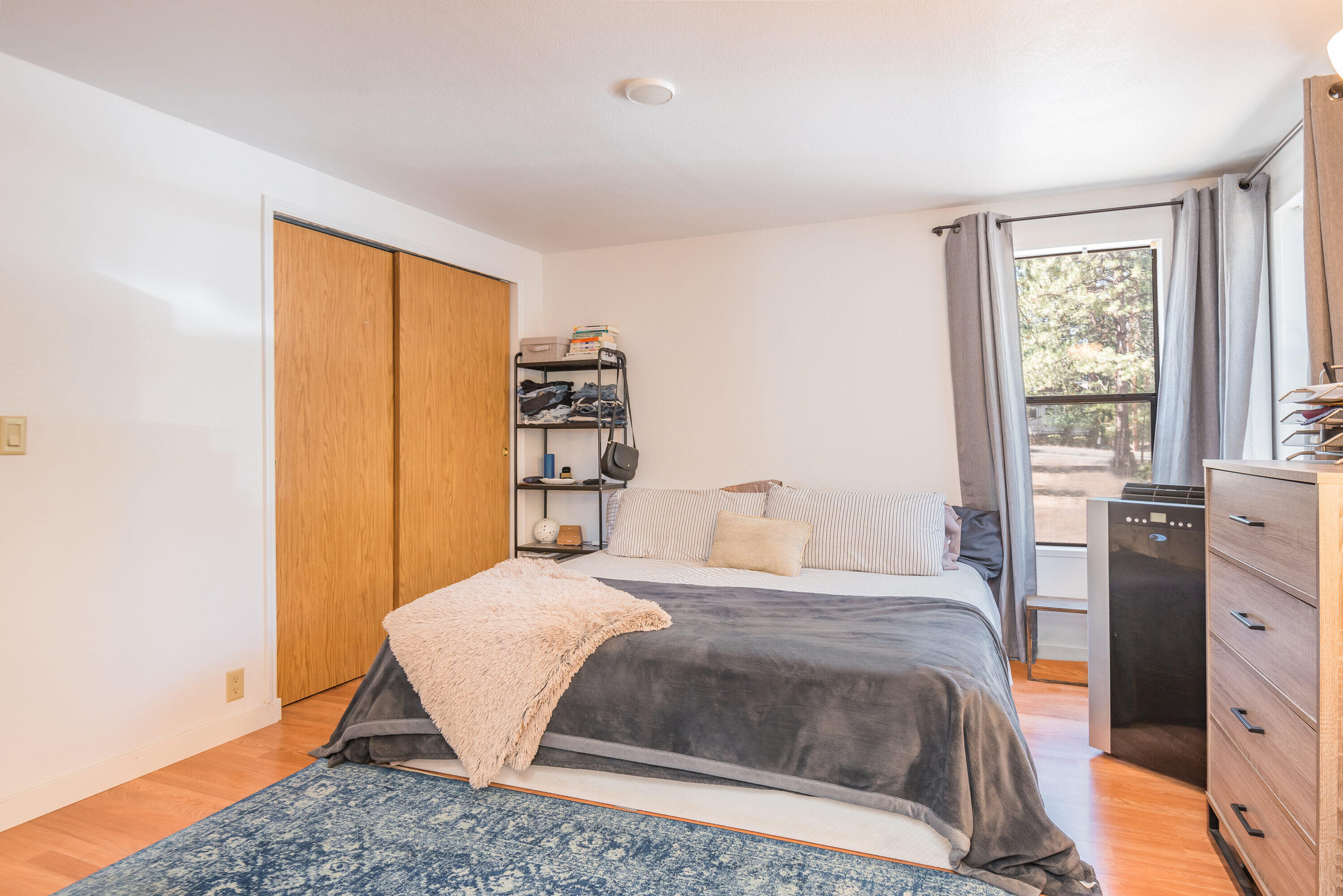 18749 Choctaw Road Bend, OR 97702 - Photo 10 of 22 a bedroom with a bed and a window