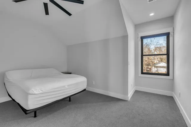 a view of a roof deck with wooden fence
