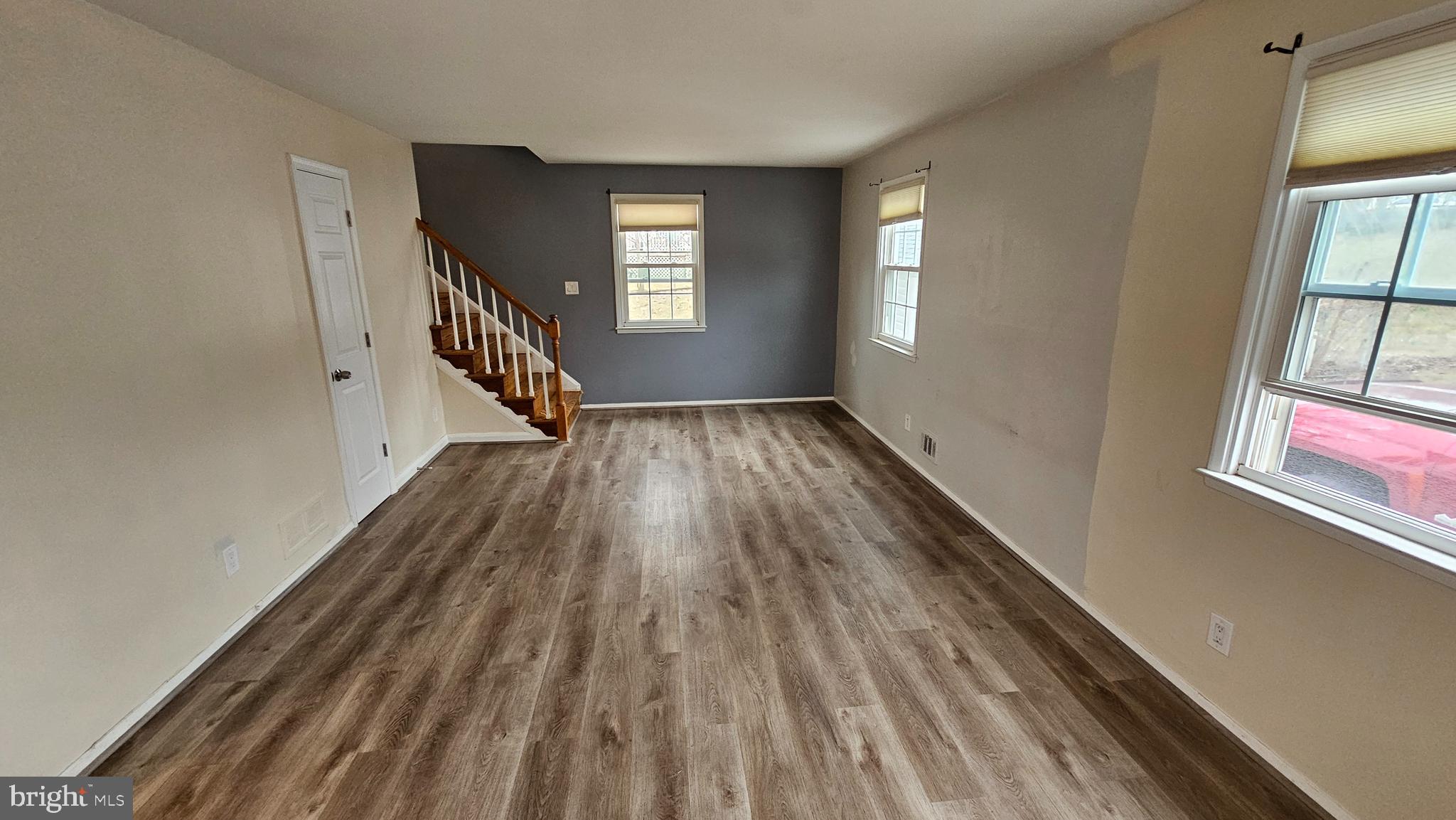 321 Ardmore Road Linthicum Heights, MD 21090 - Photo 12 of 24 a view of an empty room with wooden floor and a window
