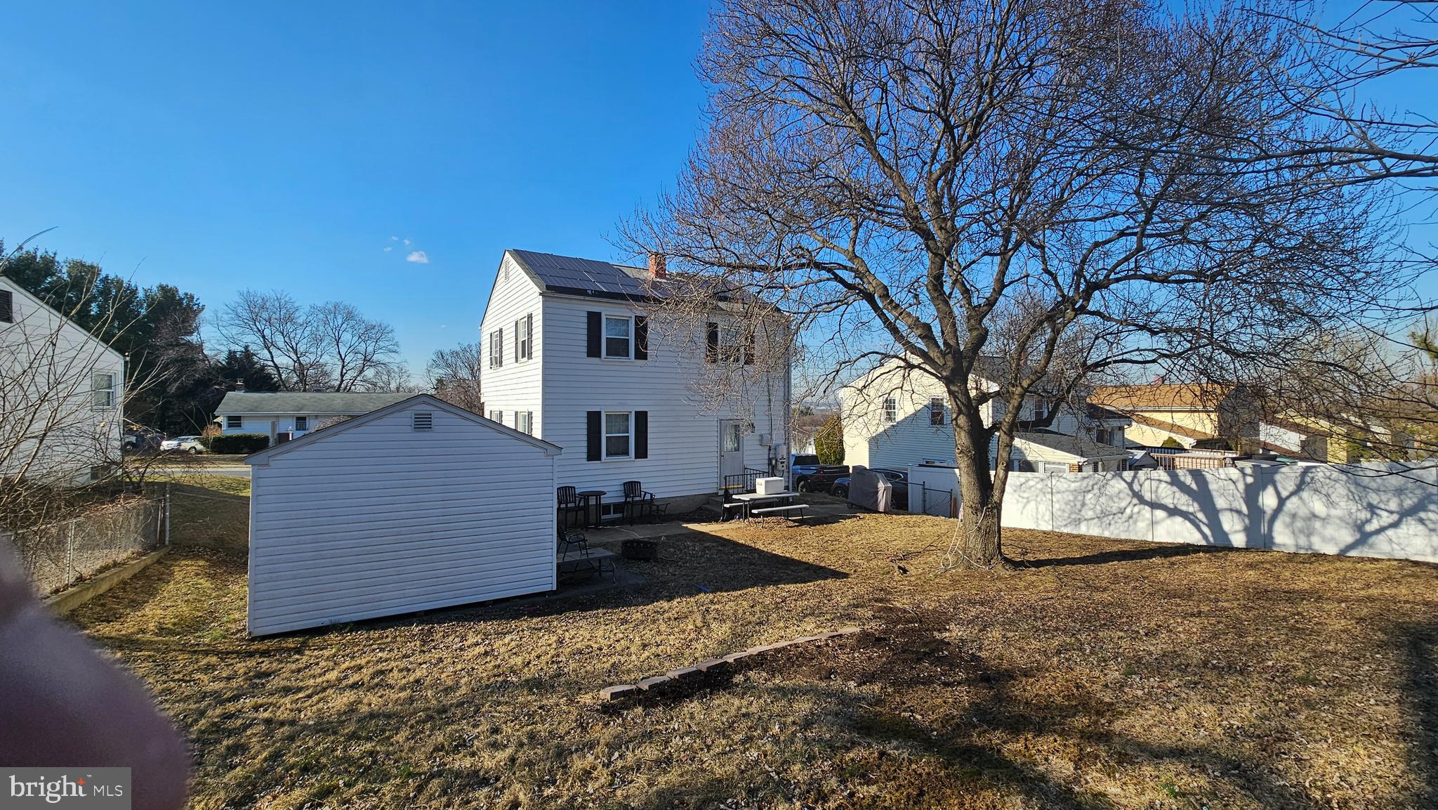 321 Ardmore Road Linthicum Heights, MD 21090 - Photo 3 of 24 a view of a house with a yard covered in snow