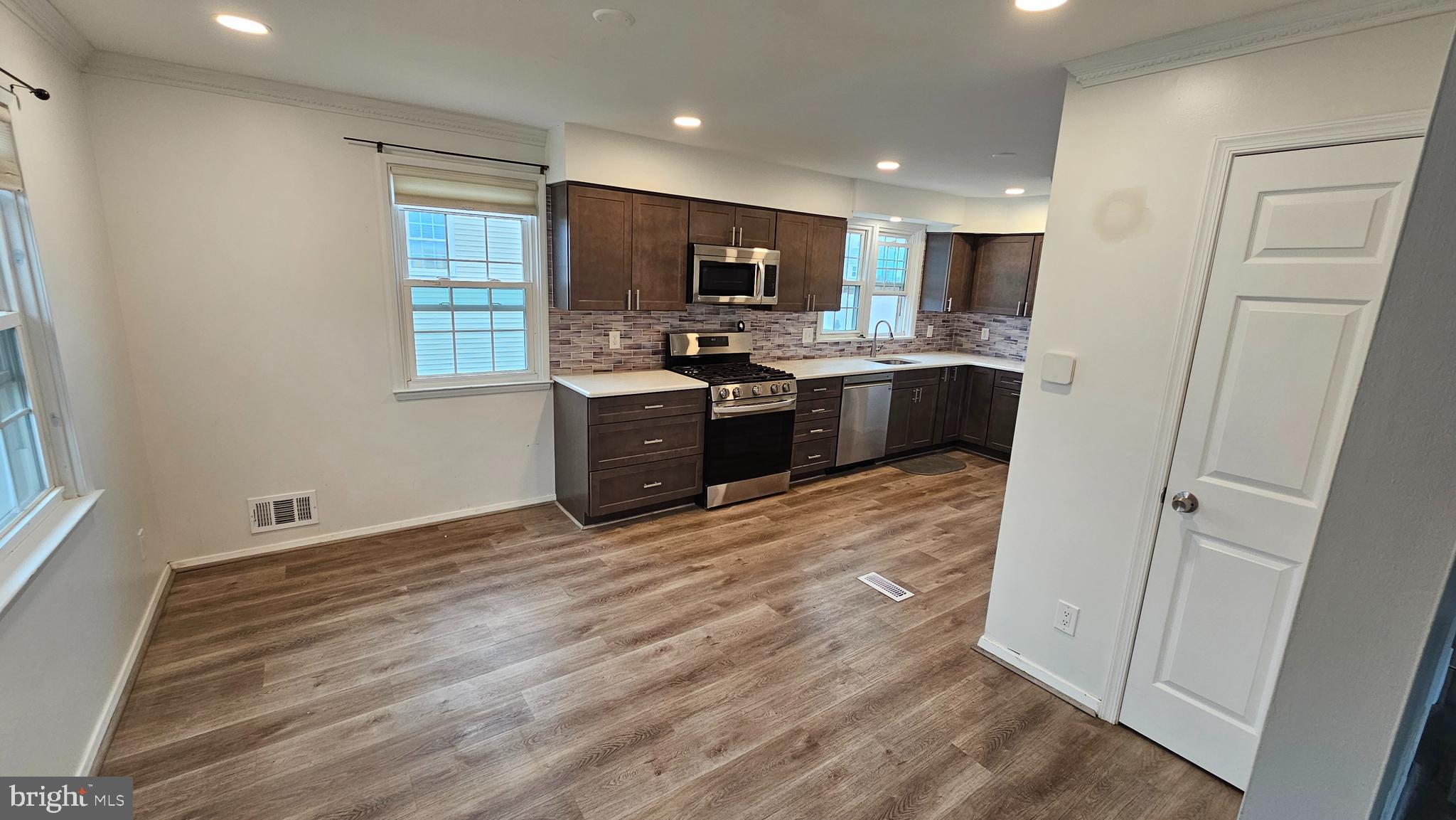 321 Ardmore Road Linthicum Heights, MD 21090 - Photo 5 of 24 a kitchen with stainless steel appliances granite countertop a refrigerator and a stove top oven