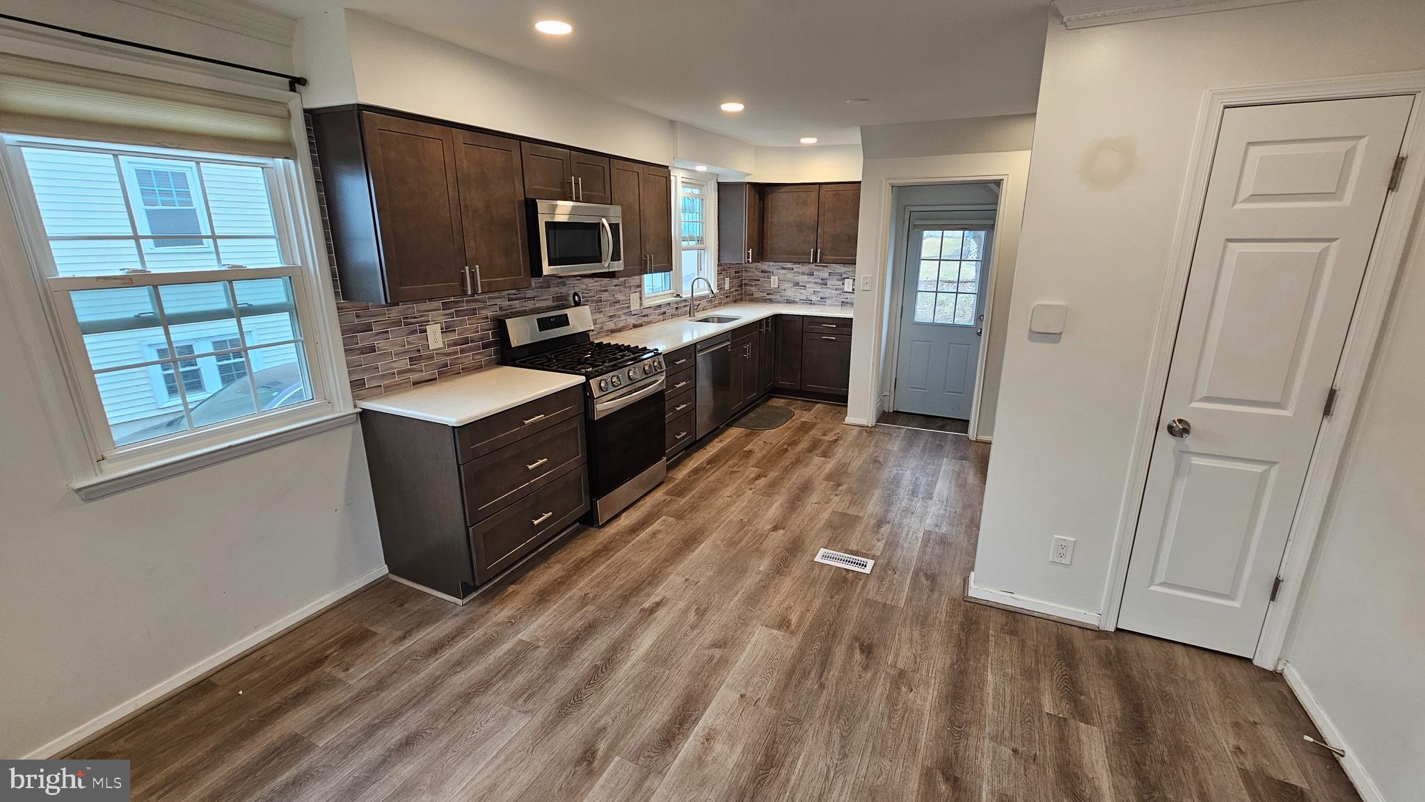 321 Ardmore Road Linthicum Heights, MD 21090 - Photo 6 of 24 a kitchen with stainless steel appliances granite countertop a stove a sink and a refrigerator