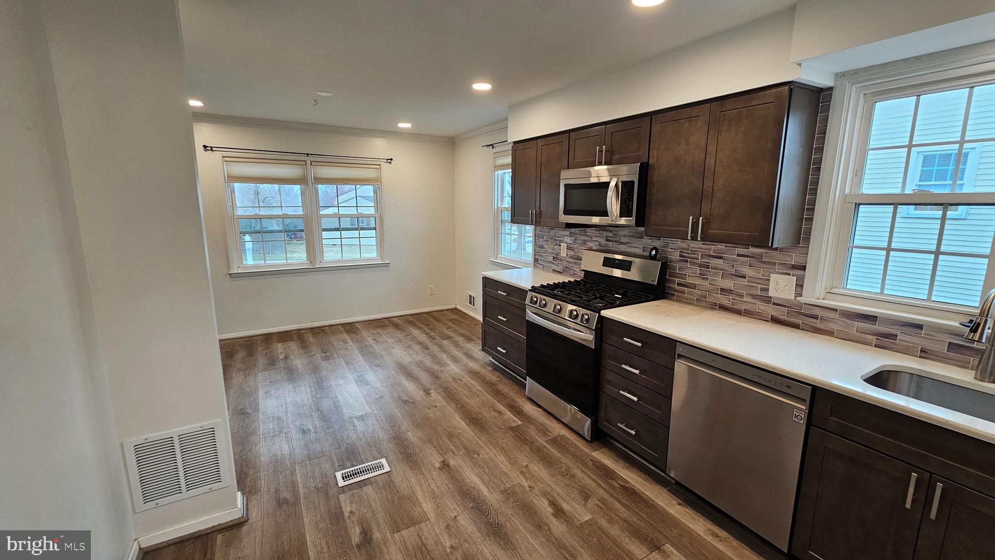 321 Ardmore Road Linthicum Heights, MD 21090 - Photo 8 of 24 a kitchen with a stove a sink and a microwave