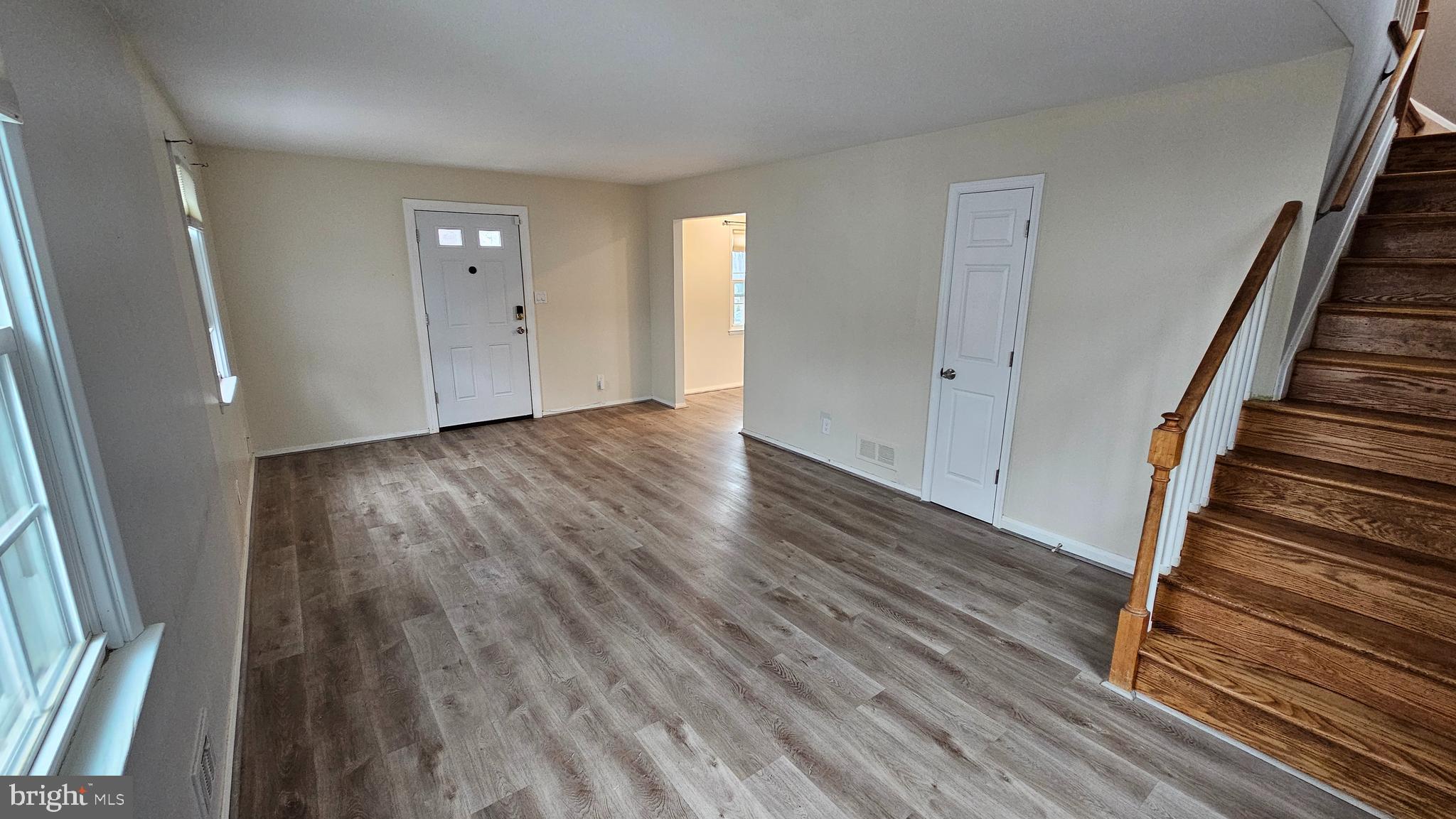 321 Ardmore Road Linthicum Heights, MD 21090 - Photo 9 of 24 an empty room with wooden floor and entryway