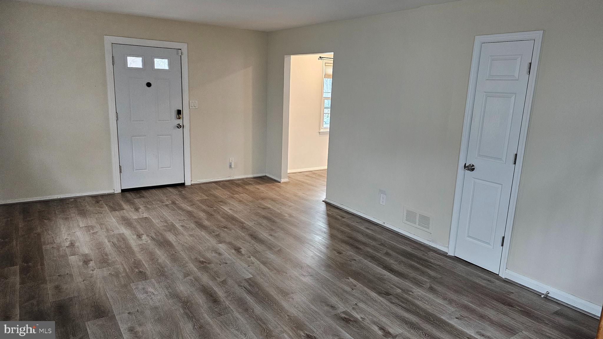 321 Ardmore Road Linthicum Heights, MD 21090 - Photo 10 of 24 a view of an empty room with wooden floor