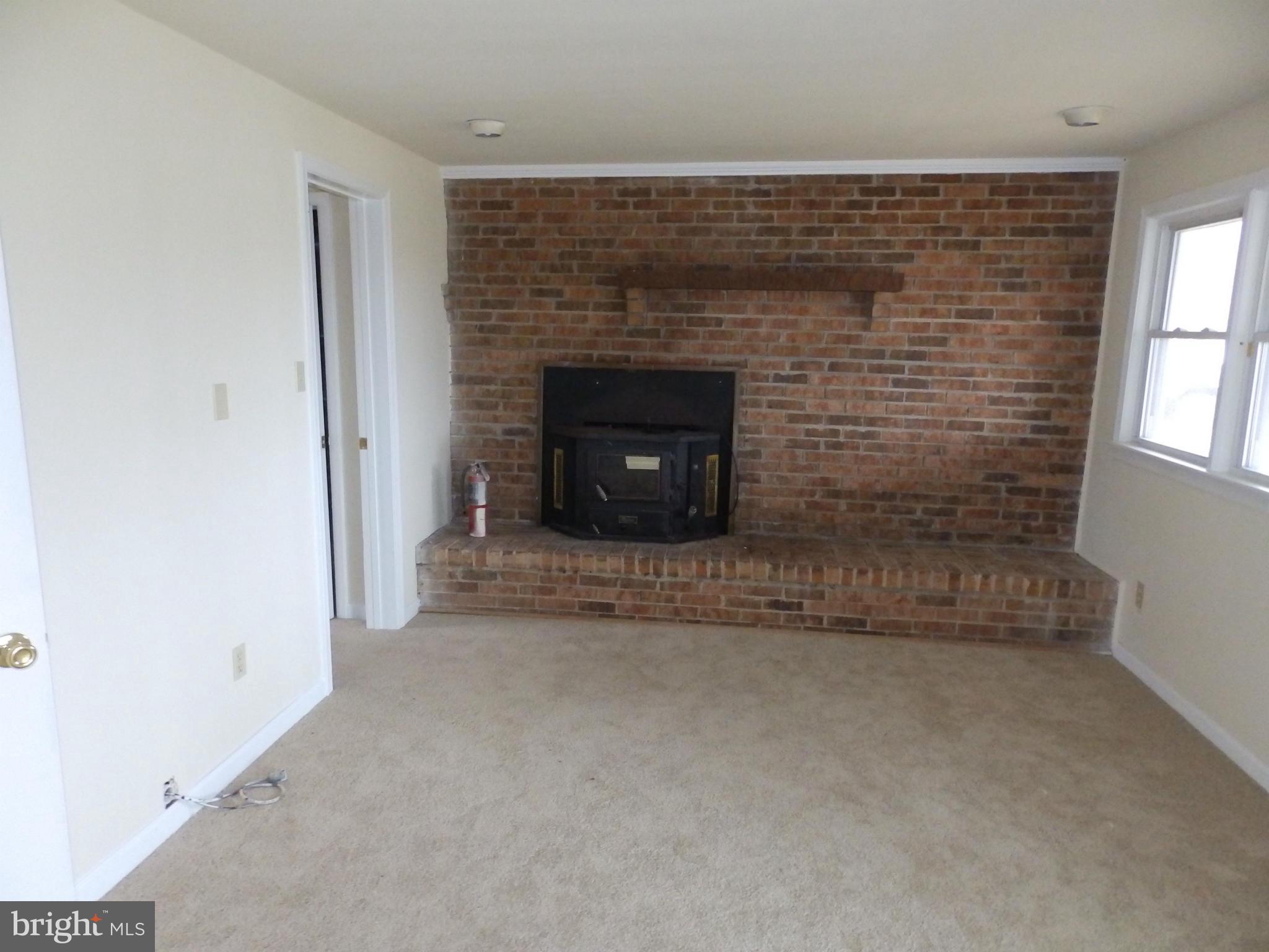 4804 Ridge Road Mount Airy, MD 21771 - Photo 21 of 25 Family Room with Brick wall and FP