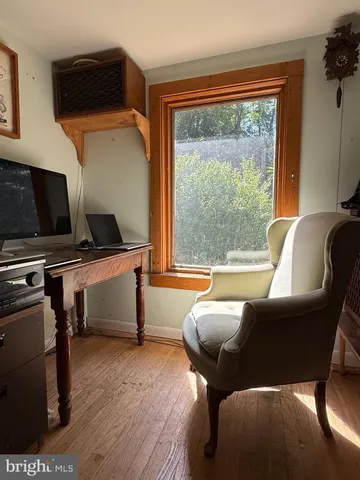 a room with a dresser and a wooden floor