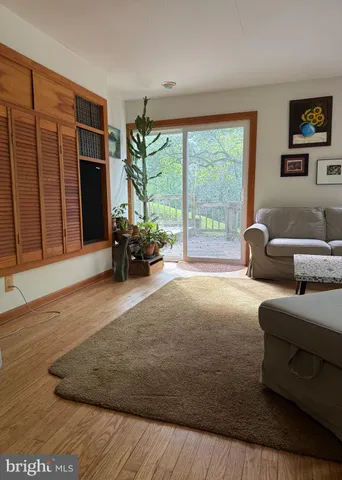 a living room with furniture and large window