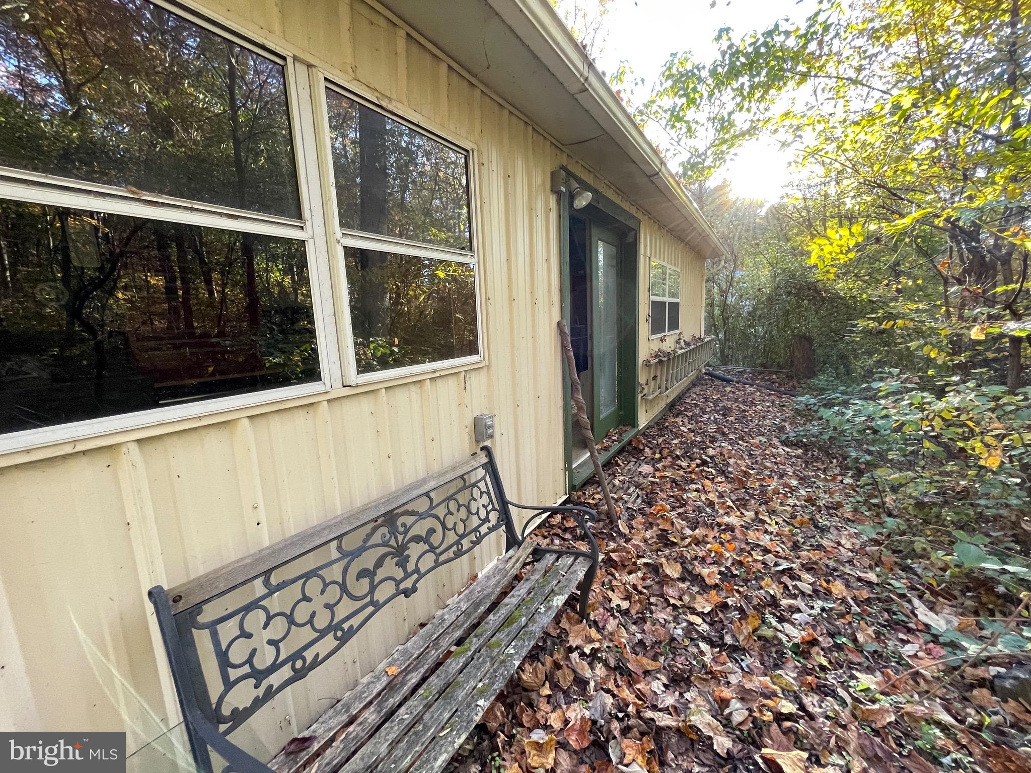 236 Piedmont Orchard Road Linden, VA 22642 - Photo 24 of 39 a view of a pathway of a house with a large window
