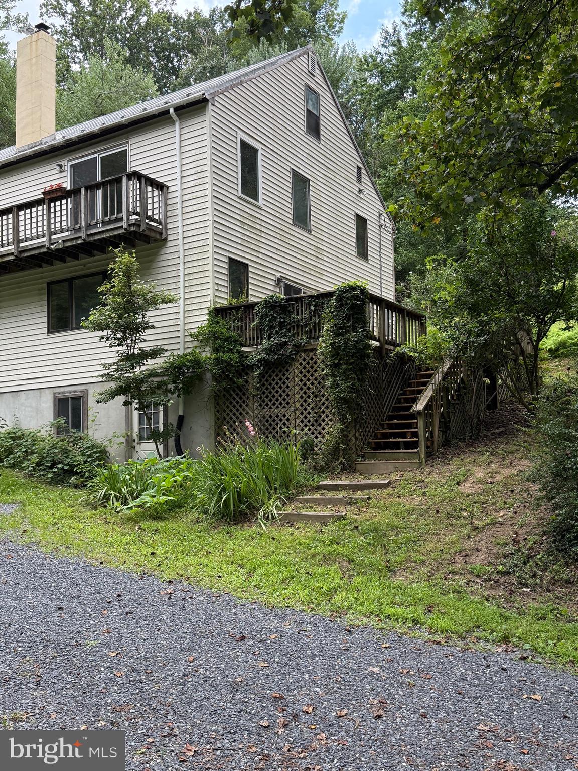 236 Piedmont Orchard Road Linden, VA 22642 - Photo 5 of 39 a front view of a house with a yard