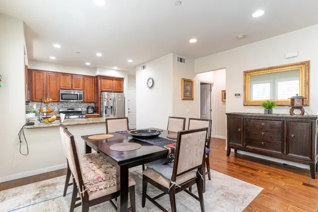 a kitchen with a table and chairs in it
