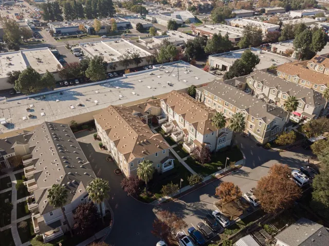 an aerial view of a city with lots of residential buildings