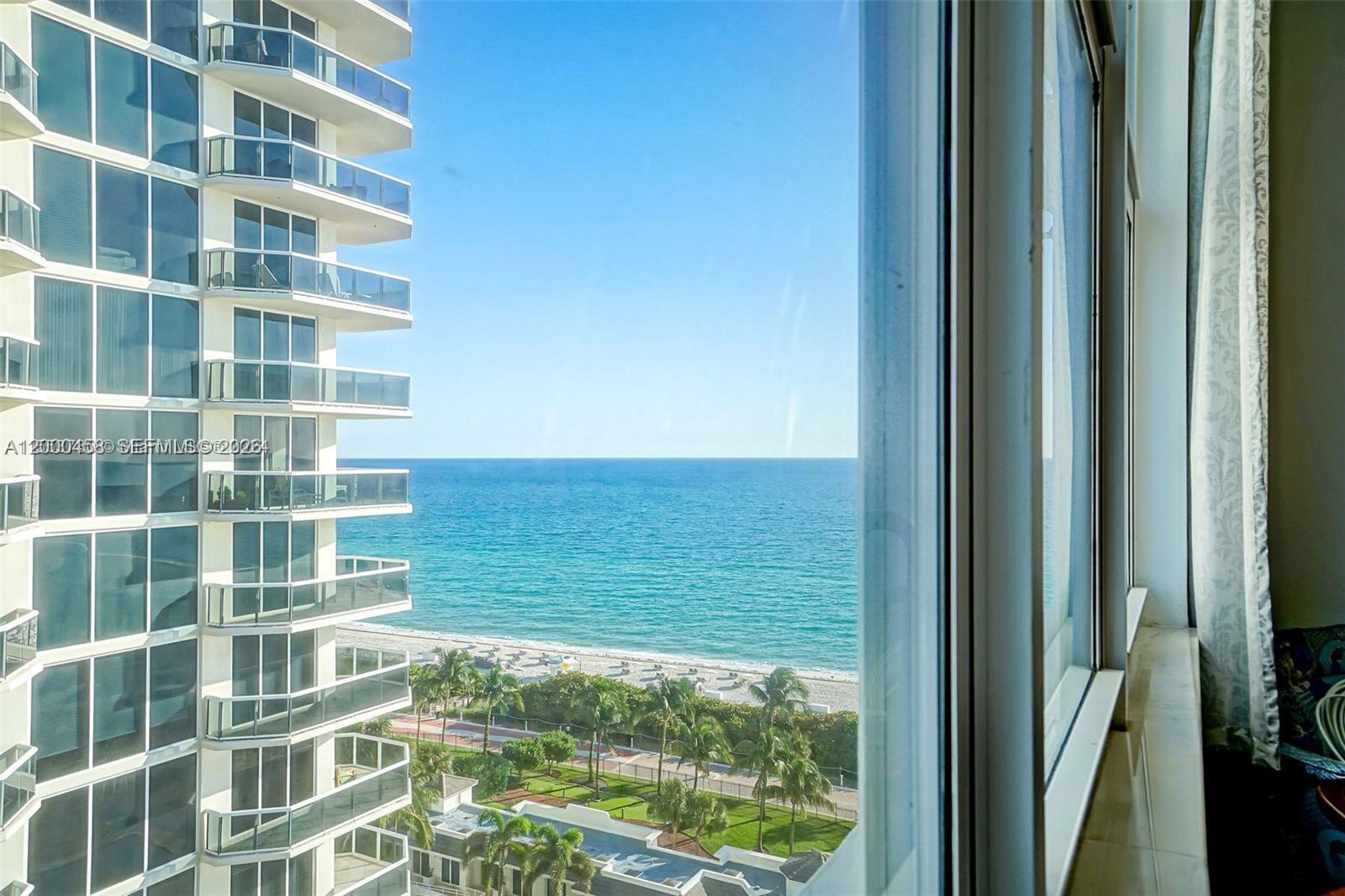 4747 Collins Avenue, Unit 1108 Miami Beach, FL 33140 - Photo 7 of 17 a view of a room with windows and gate