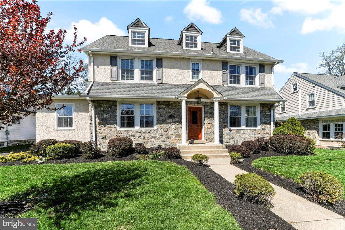 132 North Highland Road Springfield, PA 19064 - Photo 1 of 35 a front view of a house with garden and porch