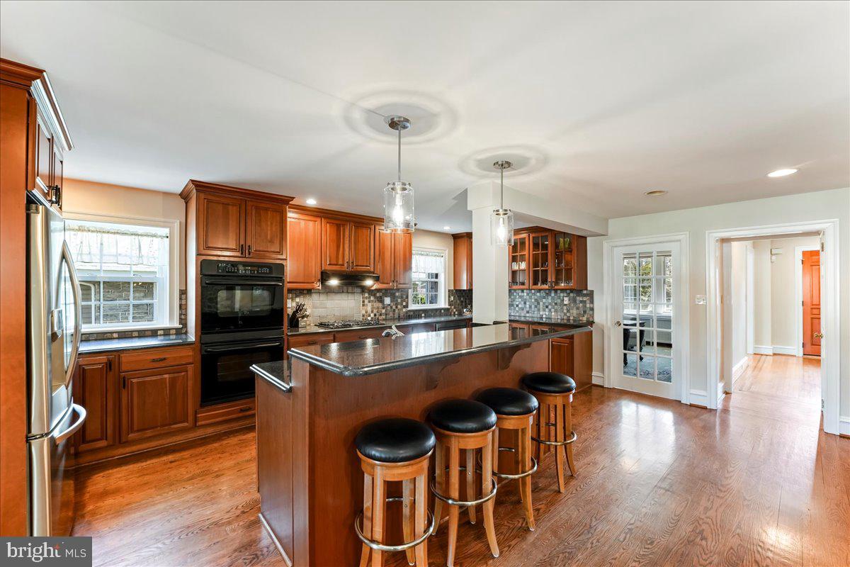 132 North Highland Road Springfield, PA 19064 - Photo 12 of 35 a large kitchen with a table and chairs