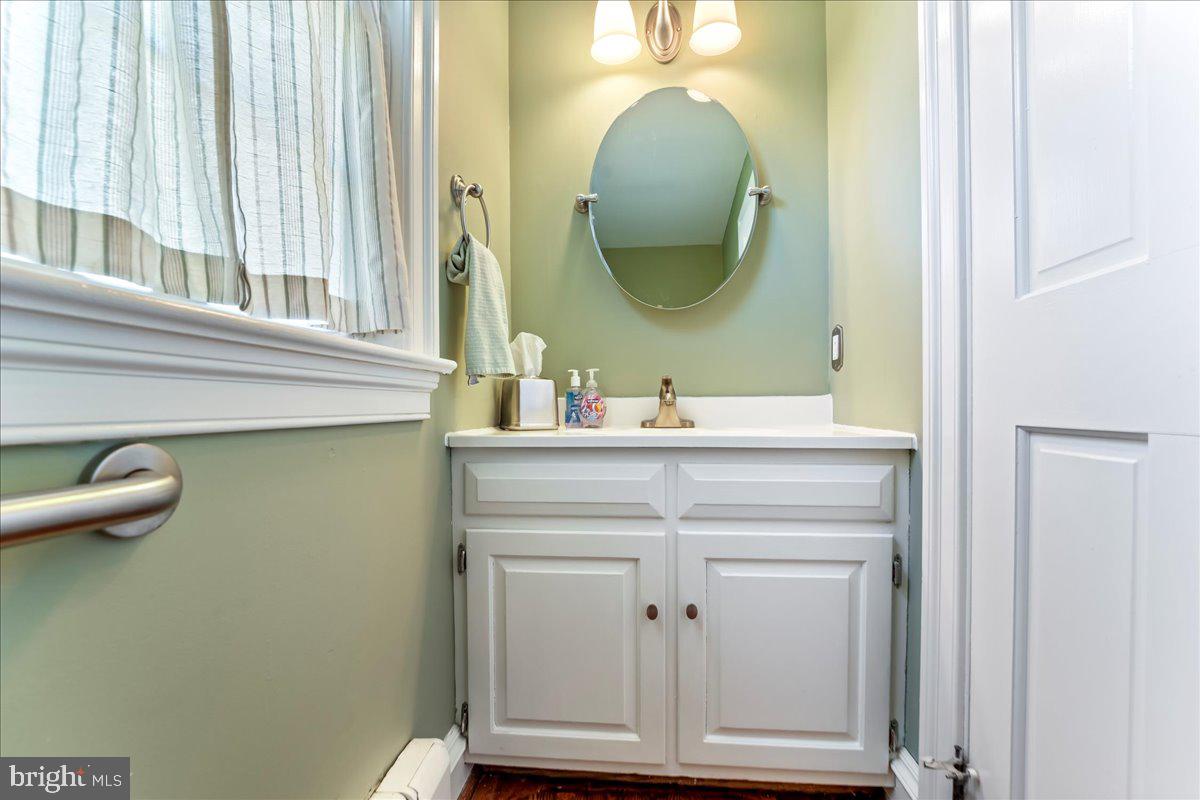 132 North Highland Road Springfield, PA 19064 - Photo 20 of 35 a bathroom with a sink and a mirror
