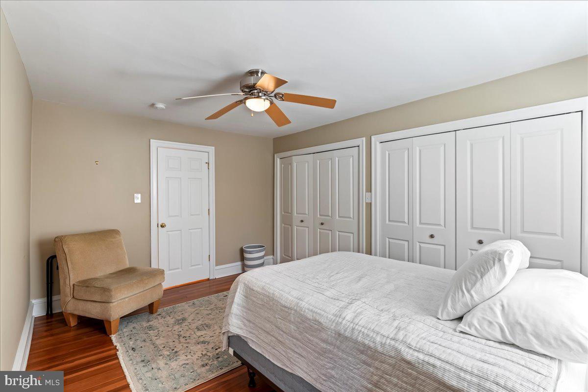 132 North Highland Road Springfield, PA 19064 - Photo 22 of 35 a bedroom with a bed a chair and potted plant on the dresser
