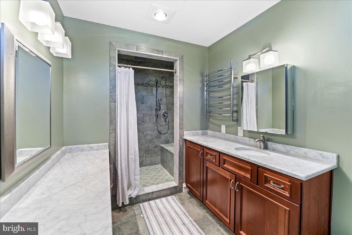 132 North Highland Road Springfield, PA 19064 - Photo 24 of 35 a bathroom with a sink and a mirror