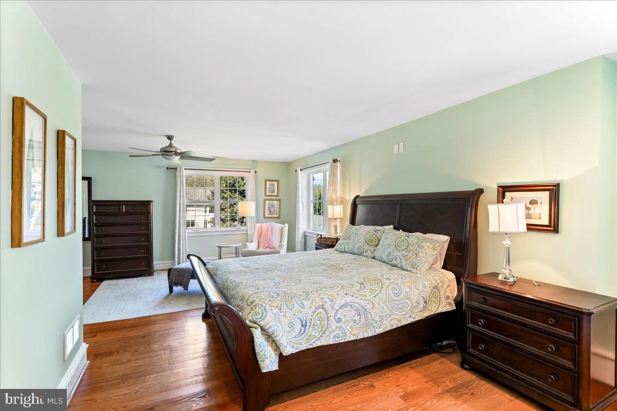 132 North Highland Road Springfield, PA 19064 - Photo 26 of 35 a bedroom with a bed and wooden floor