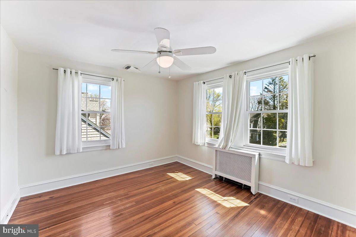 132 North Highland Road Springfield, PA 19064 - Photo 28 of 35 a view of an empty room with wooden floor and a window