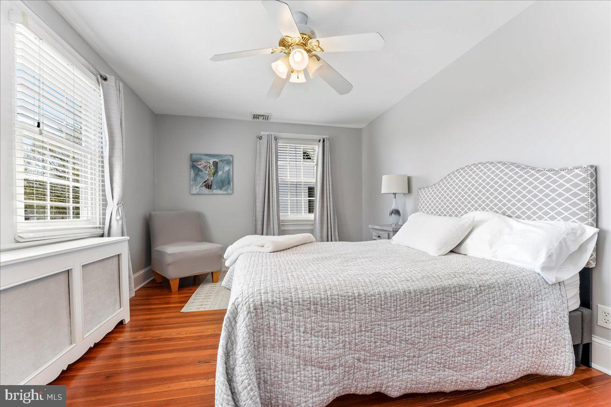 132 North Highland Road Springfield, PA 19064 - Photo 30 of 35 a bedroom with a bed and wooden floor