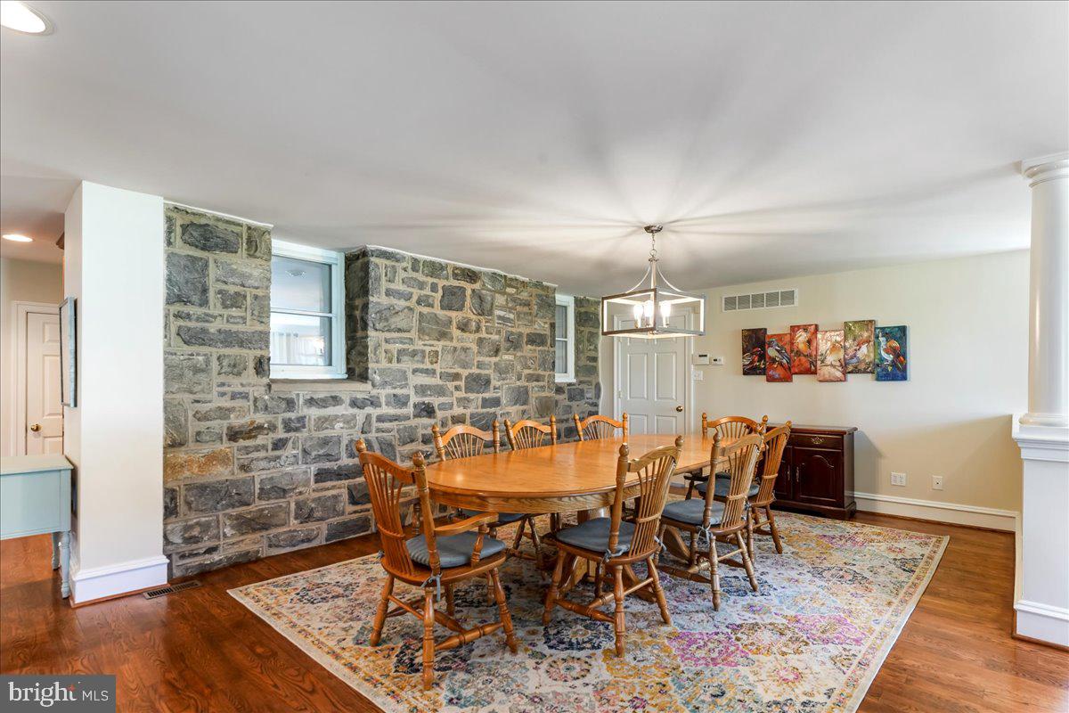 132 North Highland Road Springfield, PA 19064 - Photo 7 of 35 a dining room with furniture a rug and wooden floor