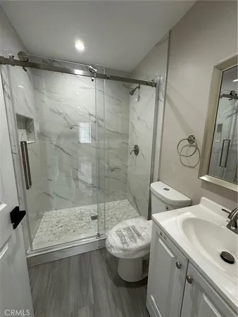 a kitchen with stainless steel appliances granite countertop a stove a microwave and cabinets