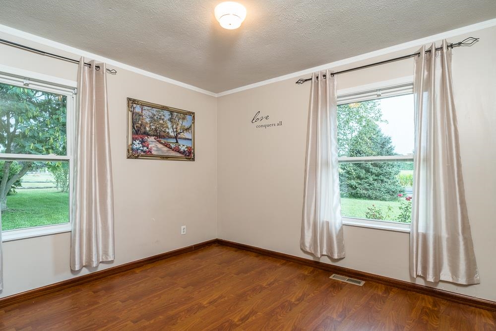 7812 Windy Cove Road Bridgewater, VA 22812 - Photo 13 of 41 a view of an empty room with a window and wooden floor