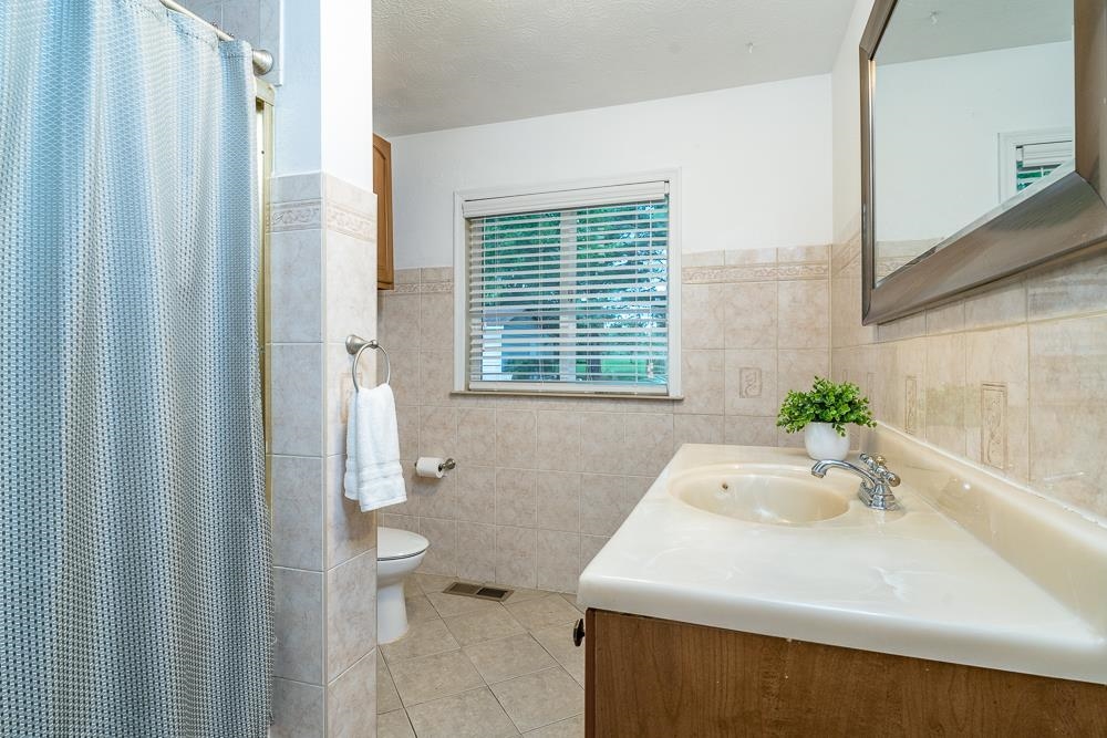 7812 Windy Cove Road Bridgewater, VA 22812 - Photo 14 of 41 a bathroom with a sink a toilet and shower
