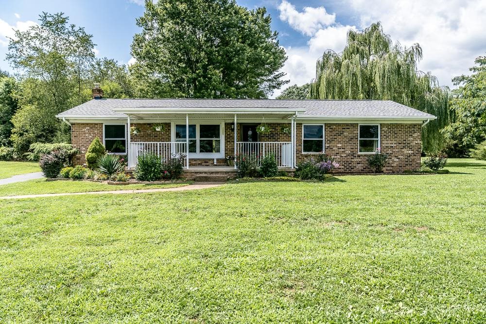 7812 Windy Cove Road Bridgewater, VA 22812 - Photo 16 of 41 a front view of a house with garden