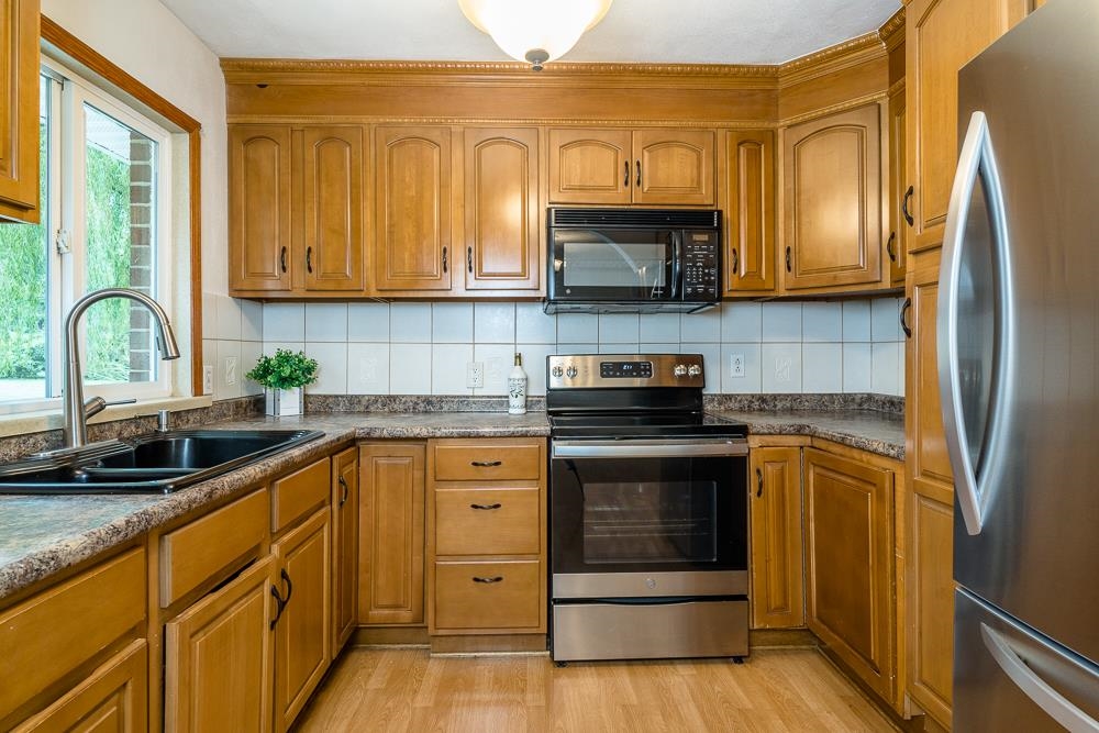 7812 Windy Cove Road Bridgewater, VA 22812 - Photo 2 of 41 a kitchen with stainless steel appliances granite countertop a stove a sink dishwasher and a refrigerator