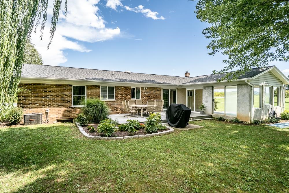 7812 Windy Cove Road Bridgewater, VA 22812 - Photo 22 of 41 a view of a house with backyard sitting area and garden