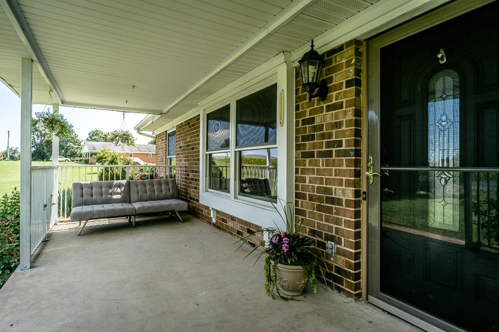 7812 Windy Cove Road Bridgewater, VA 22812 - Photo 28 of 41 a view of a porch with furniture and front door