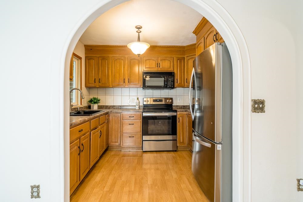 7812 Windy Cove Road Bridgewater, VA 22812 - Photo 3 of 41 a kitchen with stainless steel appliances granite countertop a stove a sink and a refrigerator