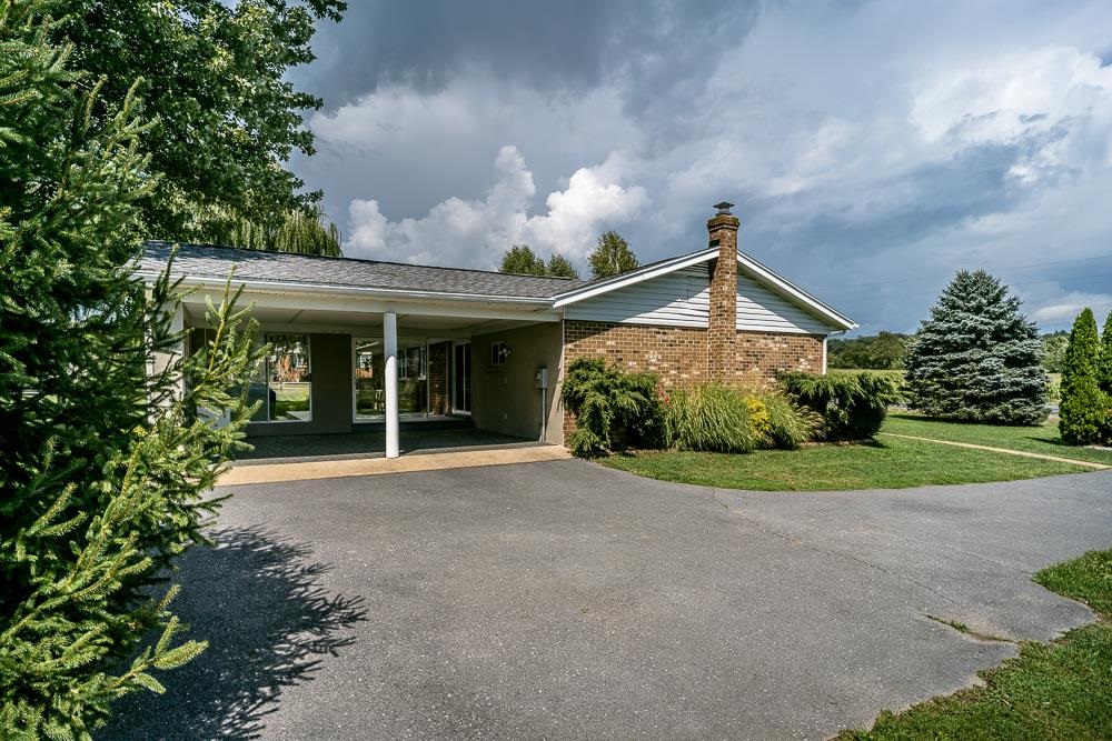 7812 Windy Cove Road Bridgewater, VA 22812 - Photo 32 of 41 a front view of a house with garden