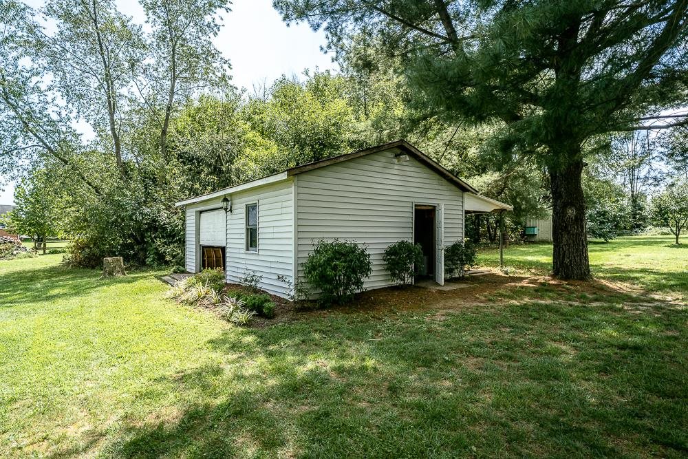 7812 Windy Cove Road Bridgewater, VA 22812 - Photo 35 of 41 a view of a house with a yard and large tree