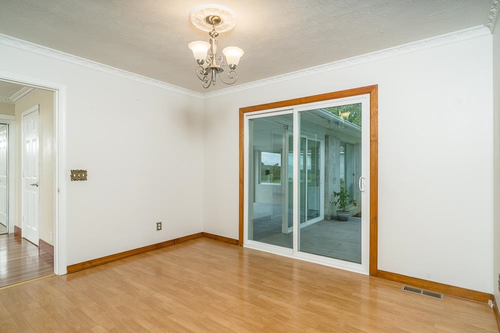 7812 Windy Cove Road Bridgewater, VA 22812 - Photo 5 of 41 a view of an empty room with glass door