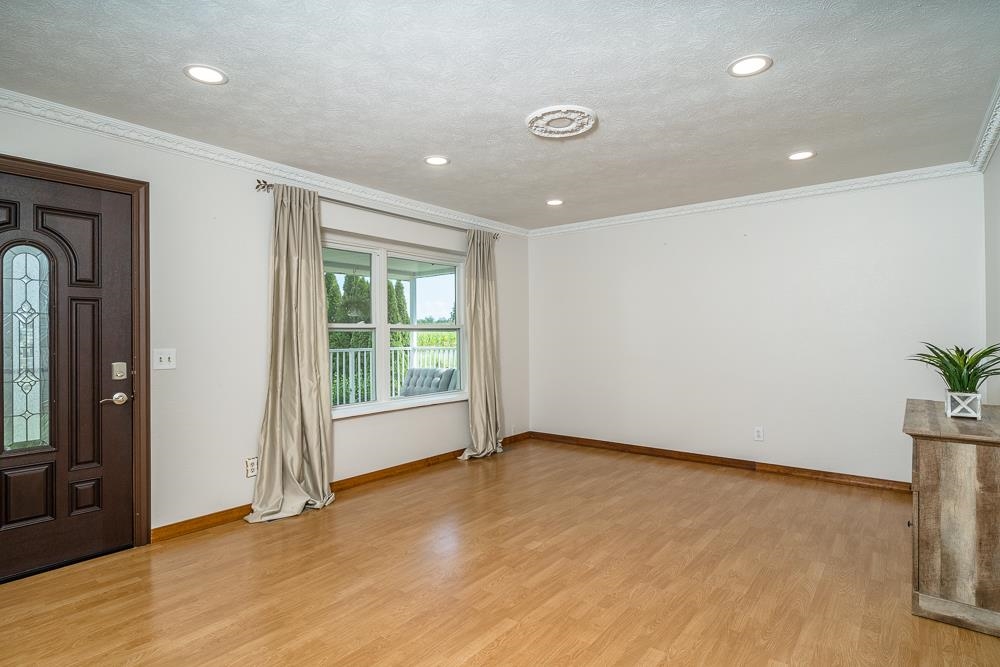 7812 Windy Cove Road Bridgewater, VA 22812 - Photo 8 of 41 an empty room with wooden floor and windows