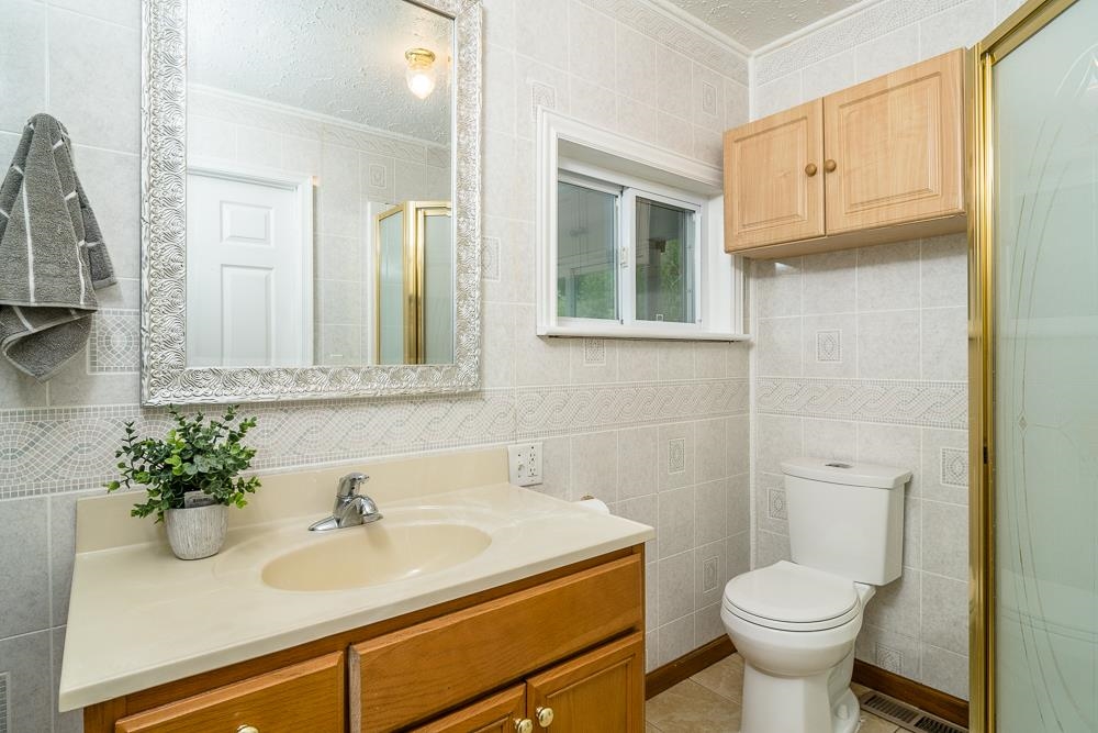 7812 Windy Cove Road Bridgewater, VA 22812 - Photo 10 of 41 a bathroom with a sink toilet and mirror