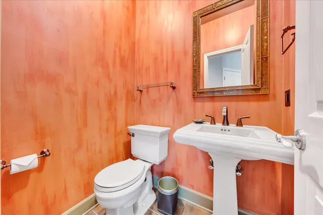 a view of an empty room with a fireplace and a large window